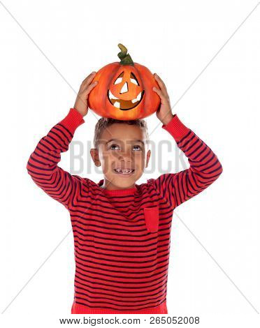 Happy latin boy holding a big pumpkin isolated on a white background