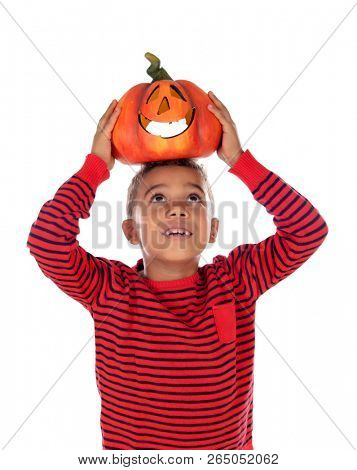Happy latin boy holding a big pumpkin isolated on a white background
