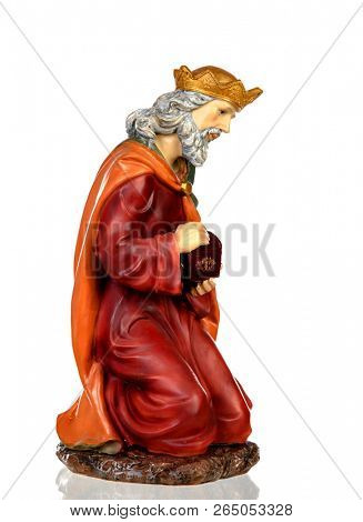 Melchor, one of the three wise men. Ceramic figure isolated on white background