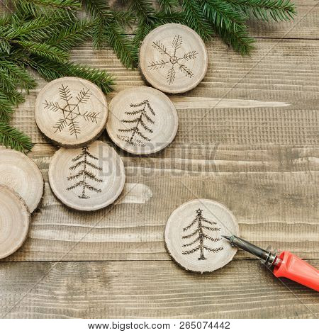 Christmas Homemade Pyrography Toys. Wooden Slice. Alternative Decor. Christmas Decorations. Close Up