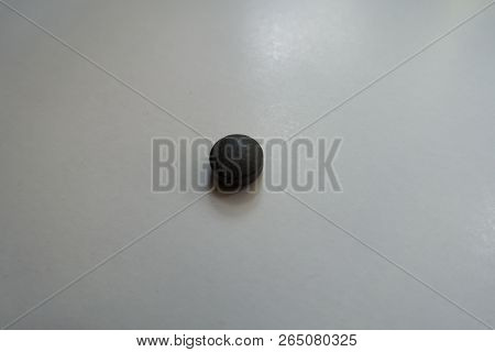 One Round Black Pill Of Chelated Iron