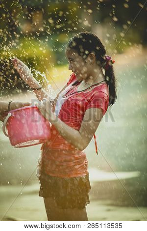 Asian Teenager Playing Water In Songkarn Day Festival Thailand
