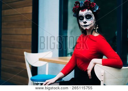 A Girl With A Painted Face Of A Skeleton, A Dead Zombie, In The City During The Day. Day Of All Soul