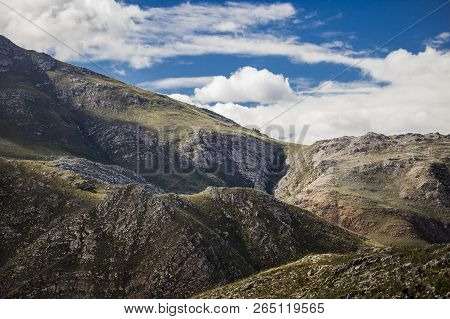 Shadows Of Clouds Over A Massive Mountain Range - Somerset West, Western Cape, South Africa.