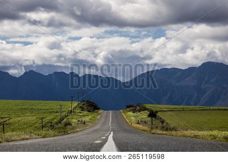 Road Through Agricultural Fields With Mountain Range In The Distance - Somerset West, Western Cape, 
