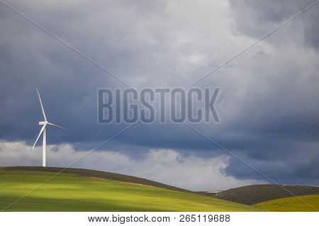 Dramatic Thunderstorm Over Wind Turbine In Green Fields - Caledon, Western Cape, South Africa.