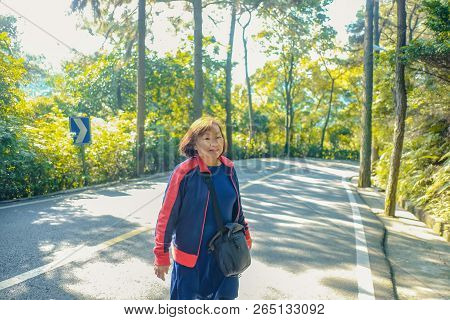Beautiful Senior Asian Women Walking In The Xiqiao Mountain Park Foshan China,china Travel