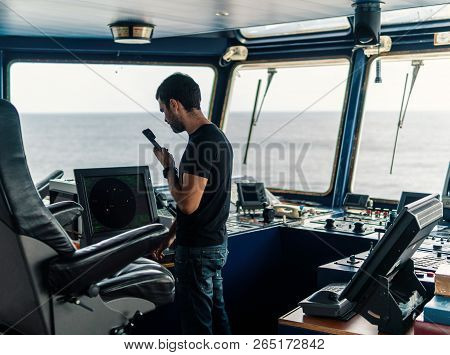 Marine Navigational Officer Is Reporting By Vhf Radio