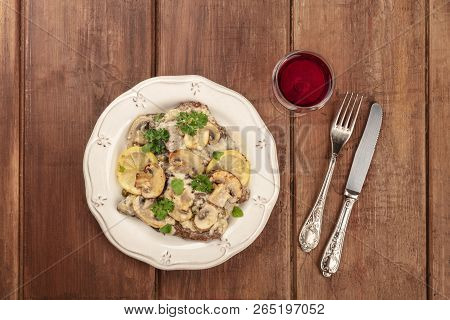 Scallopine Di Vitello, Veal Scallopini, With Mushroom Sauce, Lemons, And Parsley, Shot From The Top 