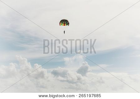 Man With Parachute In Blue Sky In Phuket