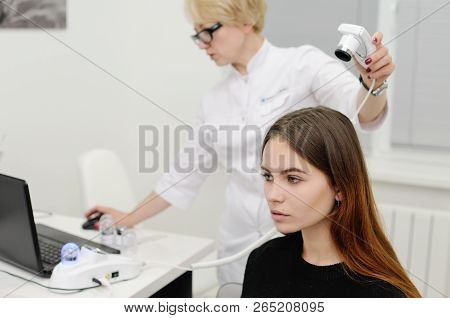 Doctor Examines The Hairy Part Of The Patient's Head