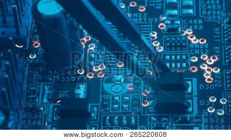 Smd Electronic Components Assembling. Tweezers Holding Resistor Capacitor Or Diod. Microelectronics 