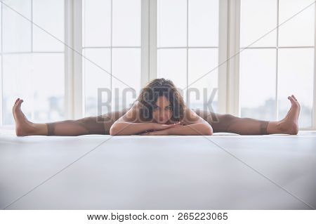 Beautiful Young Woman Practices Yoga Asana Samakonasana Straight Angle Posture In The Light Yoga Stu