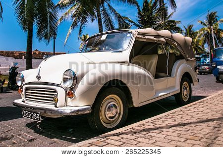 GALLE SRI LANKA - JAN 6, 2017: The Morris Minor cabriolet old timer car in the street of old Fort on Jan 6, 2017 in Galle city. Sri Lanka.