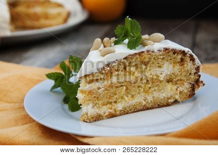 Orange And Carrotn Cake, Wooden Background. Rustic Style.