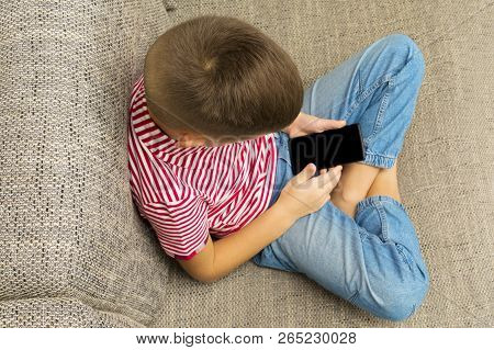 Mobile Phone In Boy Hands With Black Blank Touchscree