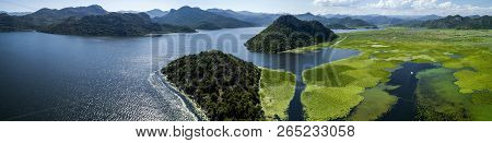 Aerial Panoramic View Of The Beautiful Landscape Of Lake Skadar In The Mountain On A Sunny Day. Mont