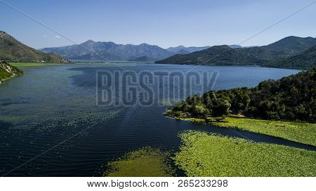 Aerial View Of The Beautiful Landscape Of Lake Skadar In The Mountain On A Sunny Day. Montenegro. Th