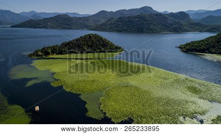 Aerial View Of The Beautiful Landscape Of Lake Skadar In The Mountain On A Sunny Day. Montenegro. Th