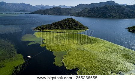 Aerial View Of The Beautiful Landscape Of Lake Skadar In The Mountain On A Sunny Day. Montenegro. Th