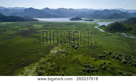Aerial View Of The Beautiful Landscape Of Lake Skadar In The Mountain On A Sunny Day. Montenegro. Th