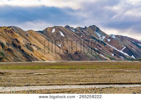 Beautiful Mountain And The Valley With The Stream Of Melting Snow At Landmannalaugar In The Fjallaba