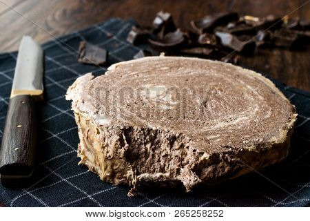 Turkish Chocolate Halva Or Helva With Knife And Chocolate Pieces
