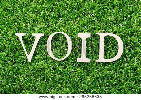 Wood Letter In Word Void On Artificial Green Grass Background