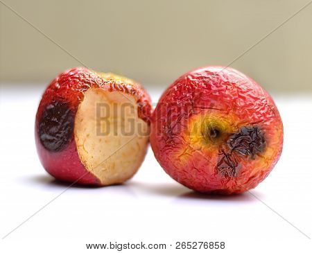 Rotten Apples On White Backgroud. Rotten Apples Skin Is Dry.