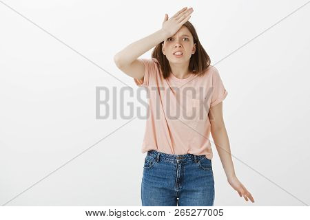 Damn, Woman Forgot To Make Importrant Call. Portrait Of Intense Worried Girlfriend Punching Herself 