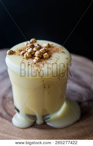 Boza Or Bosa Drink Flows From A Glass With Roasted Chickpea.