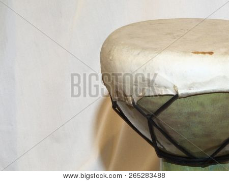 Head And Tuning Ropes Of An Of An African Doumbek Drum Against A White Backdrop From The Right Side