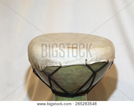 Head And Tuning Ropes Of An Of An African Doumbek Drum Against A White Backdrop In Landscape Framing