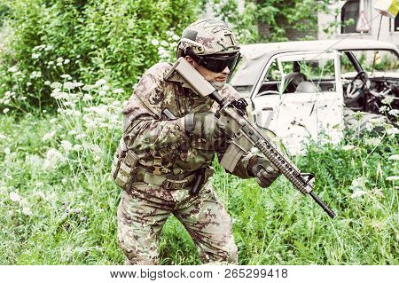 Military Man With Automatic Rifle And Rifle Scope