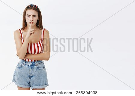 Shh Stop Saying It. Displeased Bothered Dissatisfied Good-looking Female Young Model With Fair Hair 