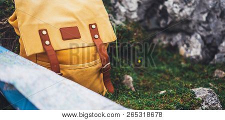 Hipster Hiker Tourist Yellow Backpack And Map Europe On Background Green Grass Nature In Mountain, B