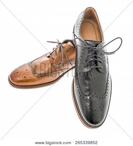 A Pair Of Mens Brown And Black Wingtip Dress Shoes On An Isolated Background