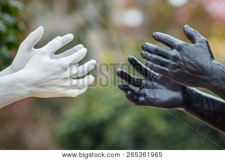 Khmelnytskyi. Ukraine. October 2018. Sculptures By Viktor Sidorenko. Hands Of People With White And 