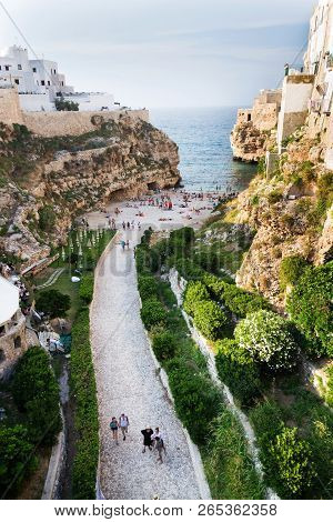 Monopoli, Italy - July 6 2018: People On Lovely Beach Lama Monachile In Polignano A Mare, Adriatic S
