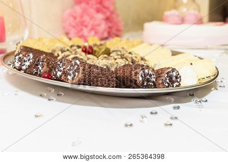 A Scrumptious Plate Of Chocolate Dipped Cannoli With Chocolate Chips. A Yummy Treat For Any Sweet To