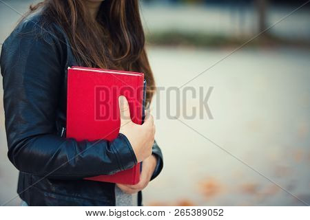 Young Woman Student Holding Books, Close Up View With Copy Space. Education Concept Lifestyle Outdoo