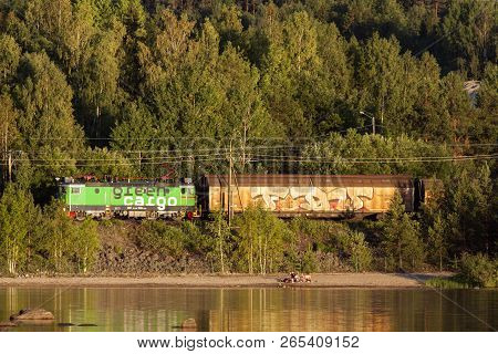 Medelpad, Sweden On July 05. View Of A Lake, A Small Beach This Side A Railway On July 05, 2018 In M