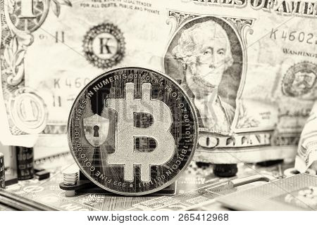 Crumpled Dollar Money And  Bitcoin In The Motherboard