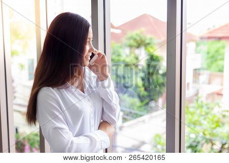 Attractive Beautiful Woman Is Calling To Her Family From Overseas Or Foreign Country By Using Mobile