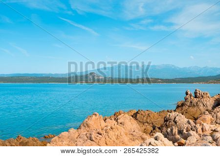 a view of the rock formations in La Tonnara, on the Southern coast of Corsica,  France, with the calm Mediterranean sea in the background