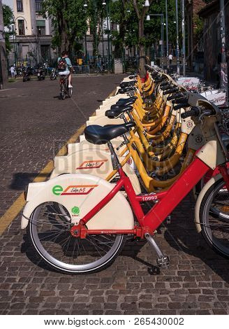 Milan, Italy - 09 May 2018: Yellow Bikemi Bicycles For Rent In A Parking Spot