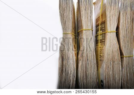 Pile Of 50 Real Euro Notes 50-euro Banknotes Under Rubber Band Isolated On White. About 20000 Euros 