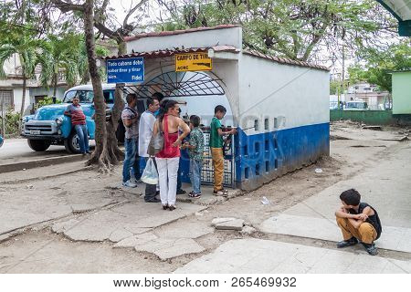 Holguin,  Cuba - Jan 28, 2016: People Wait At The Shooting Range In Holguin.