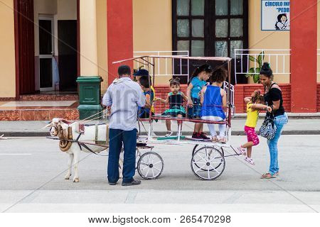 Bayamo,  Cuba - Jan 30, 2016: Kids Enjoy A Goat Ride On Cespedes Square  In Bayamo, Cuba