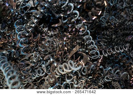 Metal Chips In The Form Of A Spiral Waste From Turning Production For The Design Background